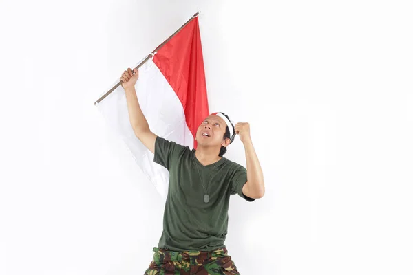 Héroe Día Indonesia Hombre Mirando Hacia Arriba Sosteniendo Ondeando Bandera —  Fotos de Stock