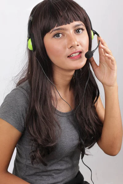 customer service rep from african american women beauty. black young a customer service representative headshot portrait with her headset on ready to work