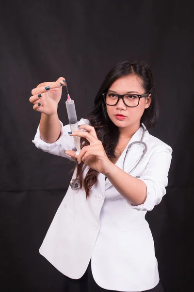 indonesia woman doctor holding stethoscope, report on white background