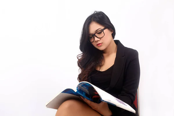 indonesia woman holding book. business indonesia woman sitting with book