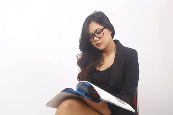 indonesia business woman with glasses and holding book on white background