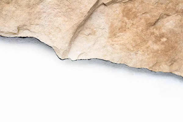 Beautiful piece of warm limestone texture on white background — Stock Photo, Image