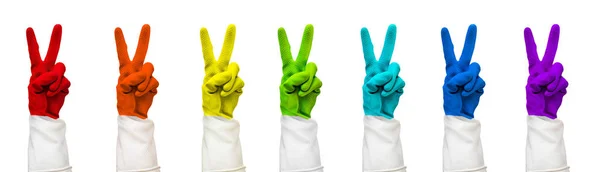 Rainbow color rubber gloves on white with clipping path — Stock Photo, Image
