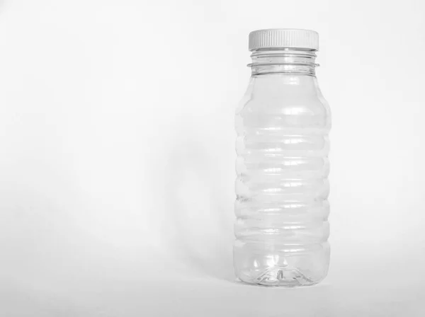 Empty plastic bottle with white wide cover isolated on white background — Stock Photo, Image
