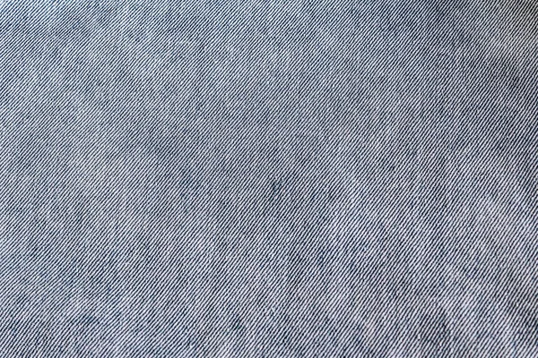 Blauwe jeans stof denim textuur achtergrond. Close-up — Stockfoto