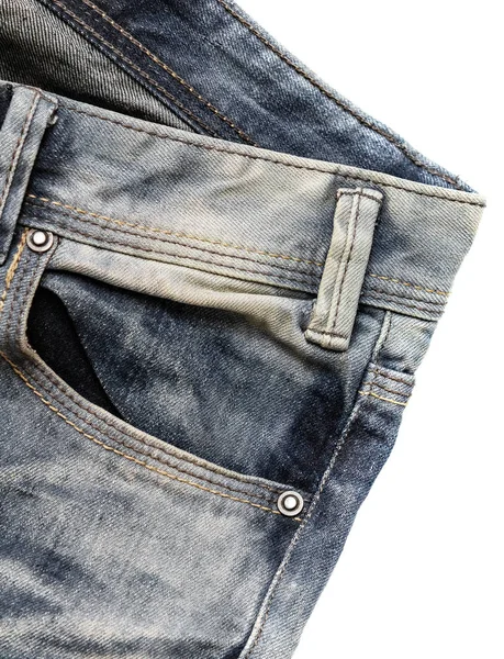 pocket of jeans, denim fabric texture with scuffs, aged denim