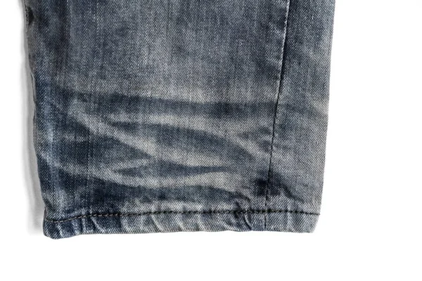 Denim legs jeans shabby texture with seam isolated on a white background -close up — Stock Photo, Image