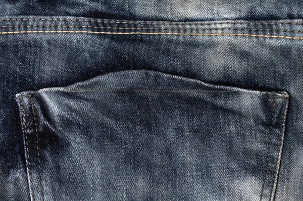 empty back jeans pocket close-up, navy denim texture, double rough straight stitch on jeans