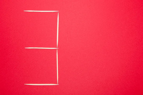 Decorative letter three in toothpicks letters on a red background — Stock Photo, Image