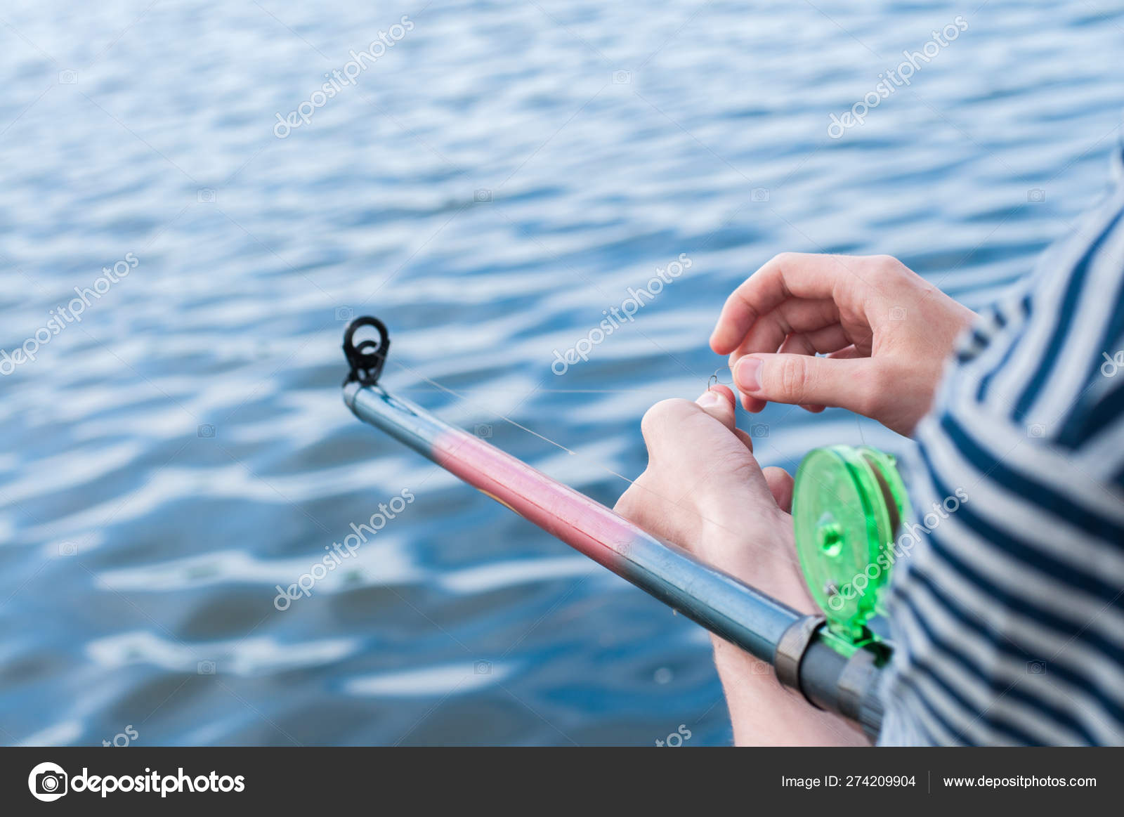 Man unraveling to the tangled and knotted Fishing line. Problem solving