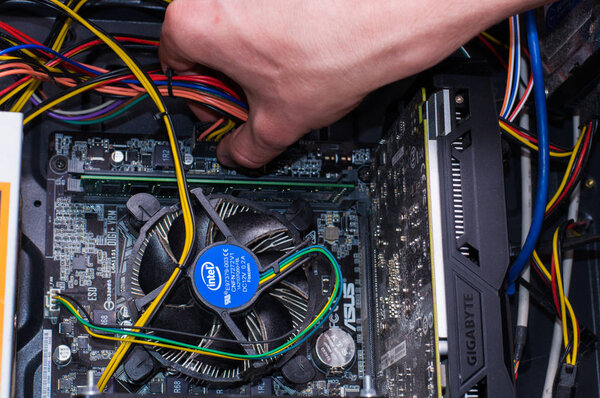 Computer repairing. Man repair black pc