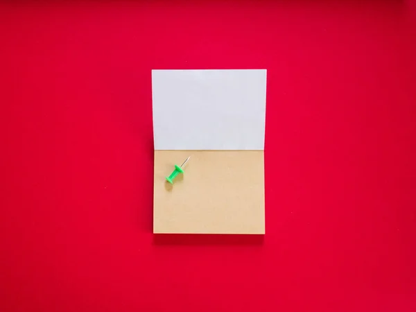 Notepad on red copy space top view — Stock Photo, Image