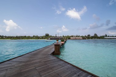 A landscape of one Maldives island - which is considered to be the most lavish, popular vacay destination in Asia because of its varity of foods, laxurious water and beach villa, and tranquil staycation