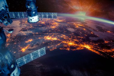 Atlantic coast of the United States night lights and sunrise with lens flare from the space station. Earth with eclipse on starry sky. Elements of this image furnished by NASA. clipart