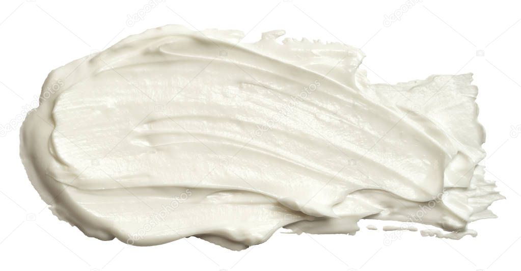Smear of white face cream texture. A sample of a cosmetic product, body cream. Isolated on white background.