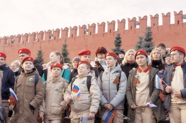 Moscow, Russia - November 7, 2018: young patriotic youth is in the front row  on the Parade dedicated to November 7, 1941 on Red Square in Moscow. 77th anniversary. clipart