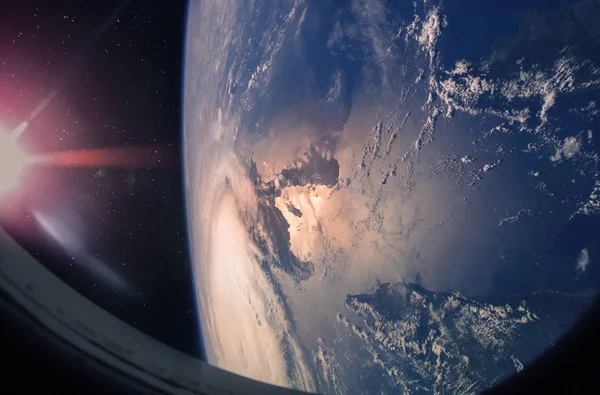 Planet Earth and hurricane from the outer space from the ISS window. Elements of this image furnished by NASA.