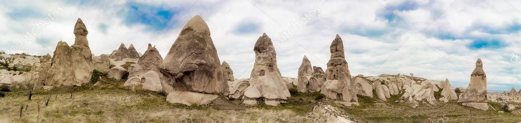Panoramic view of the valley in Goreme village, Turkey. Rural Cappadocia landscape. Volcanic mountains in Goreme national park. Countryside lifestyle.