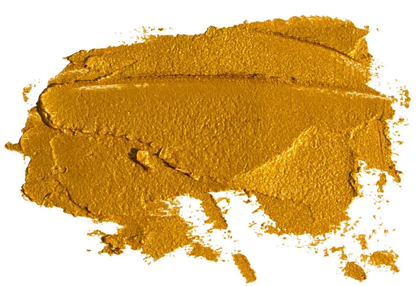 白で単離された化粧品のサンプルとして粉砕された金色のアイシャドウの塗りつぶし — ストック写真
