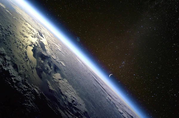 Quarter crescent moon and the thin line of Earth atmosphere over the island of Hispaniola. Collage. Elements of this image furnished by NASA.