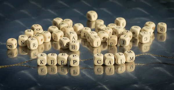 Wooden Cubes Keep Calm Inscription Strung Thread Reflective Table — Stock fotografie