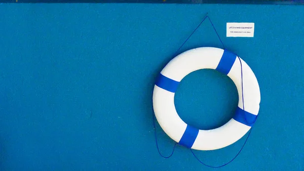 white life bouy blue back ground