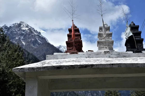 Buddhist arches welcome the traveler at the entrance to the village, Nepal, April