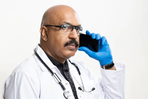 A doctor giving advice to a patient through a call due to the lock-down.