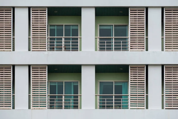 Duplicates of windows and balconies, condos, part of the green b — Stock Photo, Image