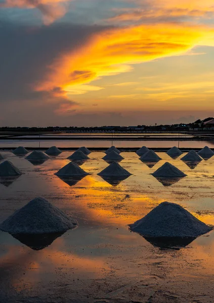 Salt in the salt fields in the evening During the shoveling of salt into the pile before transporting to the store.