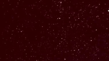 Yıldız tozu parıldayan kırmızı yıldızların parlak arka planı