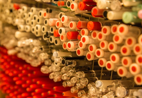 several color pens stack row in stationary shop background