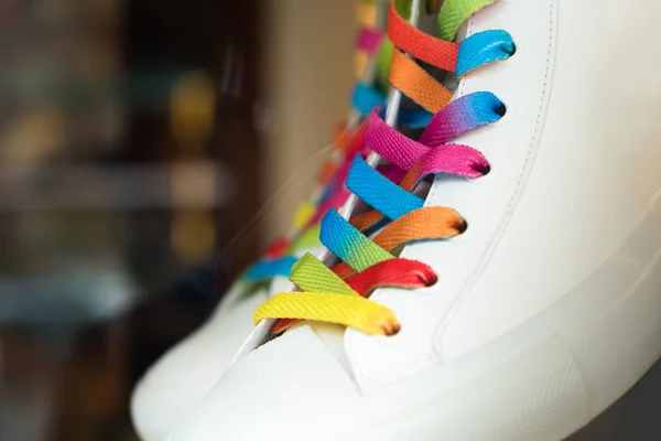 Closeup of a sneaker with colored shoelaces — Stock Photo, Image