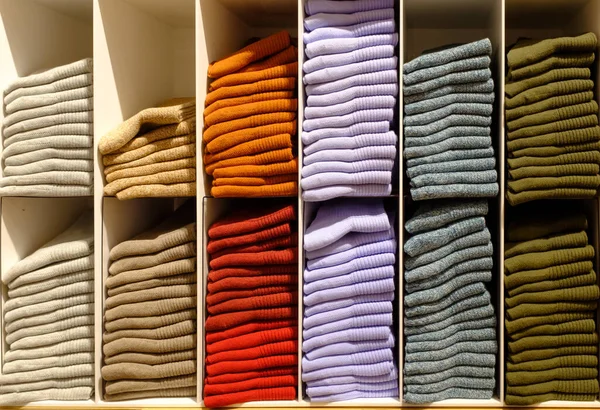 Shelves with different color sock in a clothing show case — Stok fotoğraf