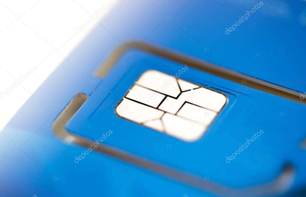 cell phone sim card closeup view on blue plastic card