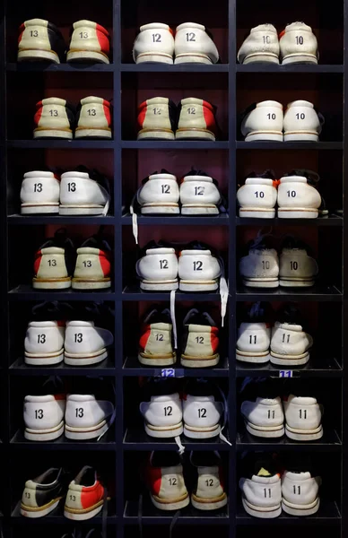 Rack with shoes for bowling in different size — Stock Photo, Image