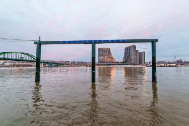 Belgrade, Serbia - February 10, 2019: A panorama of Belgrade seen from the banks of the Sava River. Old railway bridge and waterfront of Belgrade.