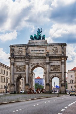 Munich, Germany - June 09, 2018: Siegestor - the triumphal arch. It was commissioned by King Ludwig I of Bavaria and completed in 1852. Dedication on the frieze means 'To the Bavarian army'.