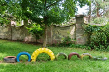 A children's playground made of old tires. clipart