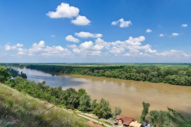 Titel, Serbia - June 25, 2020: The river Tisa and the coast of the city of Titel. Photographed from Calvary, from the Titel plateau. clipart