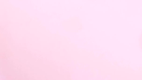 イースターの概念停止動作 卵はフレームセンター ピンクの背景を作る — ストック動画