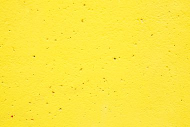 Sarı boyalı duvar dokusu. Soyut somut arkaplan