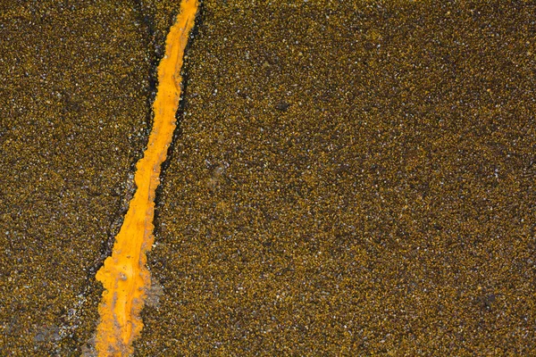 Abstract floor covering texture with yellow paint drip