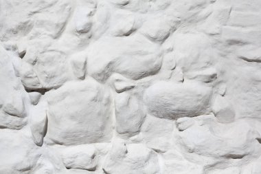 Dokulu beyazlatılmış taş duvar, pürüzlü taşlar desen, manastır duvarı, soyut arkaplan