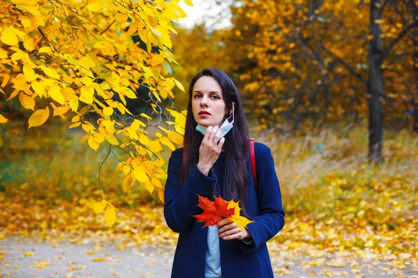 Brunette Caucasian Woman Pulling Medicine Mask Colorful Autumn Park Social — Stock Photo, Image