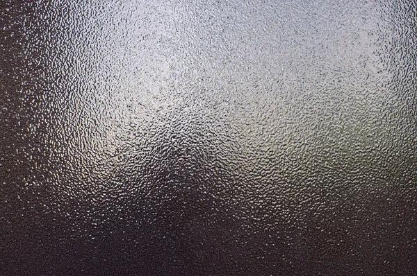 Background of brown bronze textured metal that glitters in the l — Stock Photo, Image