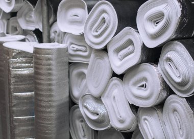Many silver large rolls of foil insulation clipart