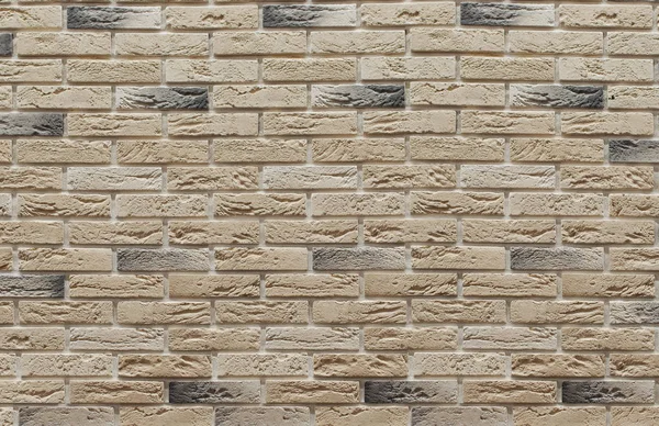 Background of masonry brown and beige clinker bricks on the wall