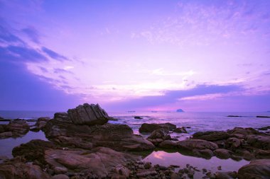 The famous natural attraction in Wanli District, New Taipei City, Taiwan, the Wanli Boxing Stone at sunrise clipart