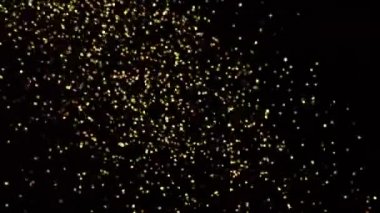 Parlayan altın folyo ve parıldayan ağır çekimde yüksek hızda çekim